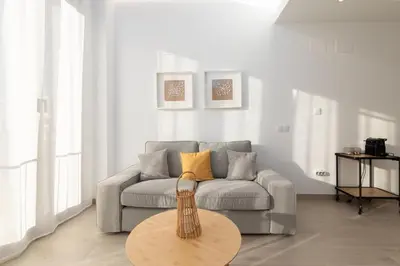 a living room with a couch and a table at Ca Celieta Beach III in Valencia