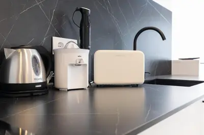 a kitchen counter with appliances on a counter top at Ca Celieta Beach III in Valencia