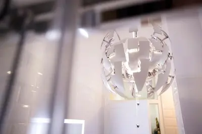 a large white chandelier in front of a door at Family Century House with terrace and parking in Valencia