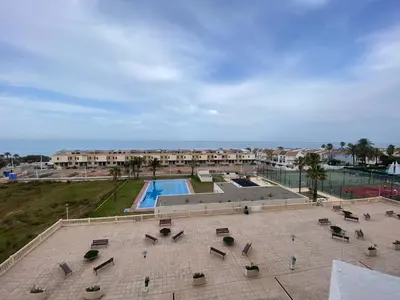 an aerial view of a resort with a swimming pool at Travel Habitat Playa del Puig in Valencia
