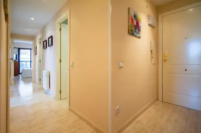 a hallway with sliding doors in a house at ESPACIO 3 - Primera Línea de Playa in Cullera