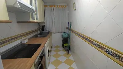a small kitchen with a sink and a counter at Apartamento Playero in Tavernes de Valldigna