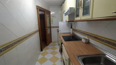 a kitchen with a sink and a counter top at Apartamento Playero in Tavernes de Valldigna
