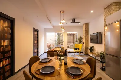 a dining room with a table and chairs at Portrait Boutique Apartment in Valencia