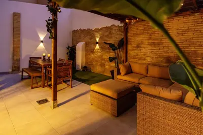 a living room with a couch and a table at Portrait Boutique Apartment in Valencia