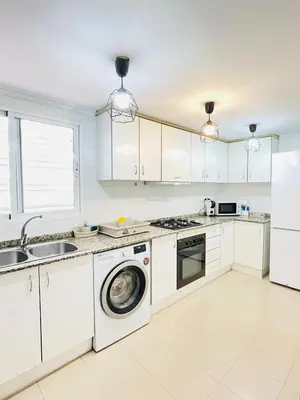 a kitchen with white cabinets and a dishwasher at UIM Mediterraneo PB Dolores Ibarruri Wifi in Puerto de Sagunto