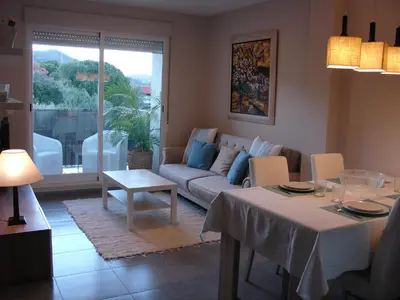 a living room with a couch and a table at Playa y Montaña Faura-Valencia in Faura