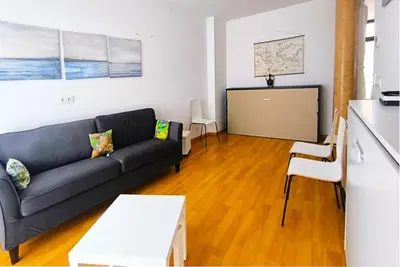 a living room with a couch and a table at Piso en el centro in Valencia