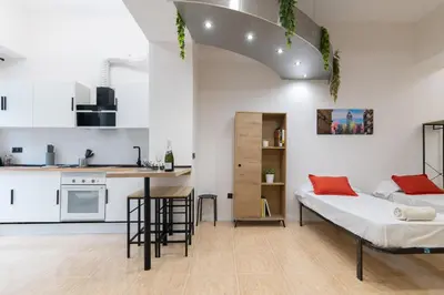 a small apartment with a bed and a kitchen at Spacious OCEANOGRAFIC Flats Valencia in Valencia