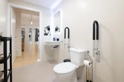 a white bathroom with a toilet and a sink at Spacious OCEANOGRAFIC Flats Valencia in Valencia