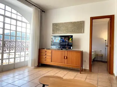 a living room with a television on a wooden dresser at Piso en Vall de Almonacid con vistas, aire acondicionado, Wifi y Smart TV in Vall de Almonacid