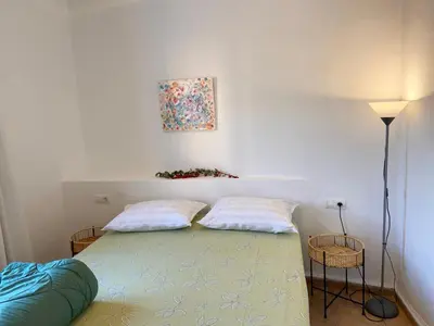 a bedroom with a bed with two pillows at Piso en Vall de Almonacid con vistas, aire acondicionado, Wifi y Smart TV in Vall de Almonacid