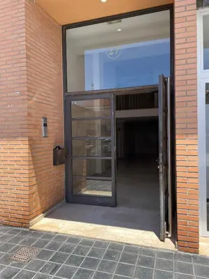 an entrance to a building with a glass door at SingularStays El Grao in Valencia