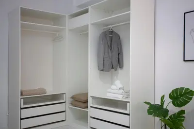 a white walk in closet with white cabinets at SingularStays Tinglado in Valencia