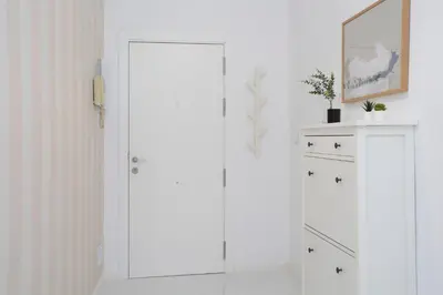 a white room with white cabinets and a mirror at SingularStays Tinglado in Valencia