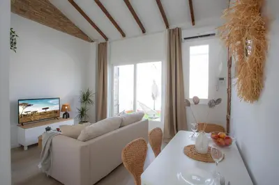 a living room with a couch and a table at SingularStays Vivons in Valencia