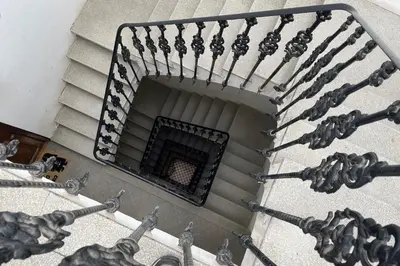 a spiral staircase with a window in a building at SingularStays Vivons in Valencia