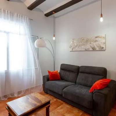 a living room with a couch and a table at Cozy apartment near the center, Torres de Serrano in Valencia