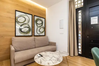 a living room with a couch and a table at Anelsa Torres de Serranos 3 in Valencia