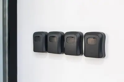 a row of four black gadgets sitting on a shelf at Anelsa Torres de Serranos 3 in Valencia