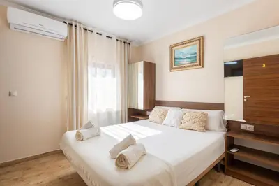 a bedroom with a bed with towels on it at Casa Navajas in Jérica