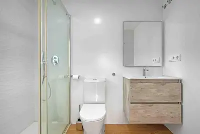 a bathroom with a toilet and a sink and a shower at Apartamento atardecer dorado in Valencia