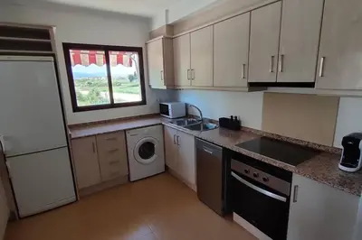 a kitchen with a sink and a washing machine at MAGNIFICO APARTAMENTO · PLAYA CANET DE BERENGUER in Canet de Berenguer