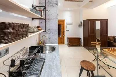 a kitchen with a sink and a counter top at Loft Botanic Center in Valencia