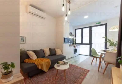a living room with a couch and a table at RA - Stylish city loft - Walk to the best of Valencia in Valencia