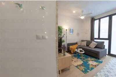 a living room with a couch and a table at RB - Urban loft retreat, comfort & good location in Valencia