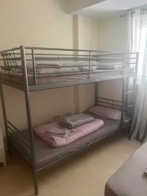two bunk beds in a room with towels on them at Wohnung in Chilches in Xilxes