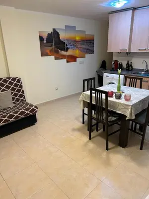 a kitchen and dining room with a table and chairs at Wohnung in Chilches in Xilxes