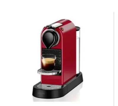 a red coffee machine with a cup of coffee at Wohnung in Chilches in Xilxes