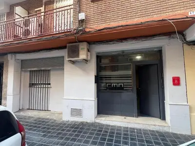 a building with a door and a balcony with a heater at RMN TOURIST HOME in Valencia