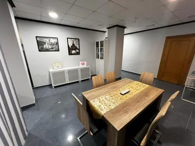 a conference room with a table and chairs in a room at RMN TOURIST HOME in Valencia