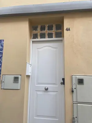 a door to a house with a sign on it at Maison Sereine in Valencia
