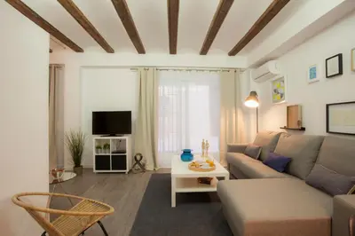 a living room with a couch and a table at SingularStays Mercado Central in Valencia