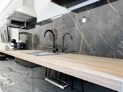 a kitchen with a wooden counter with two faucets at Apartamento en la Gran Manzana in Valencia