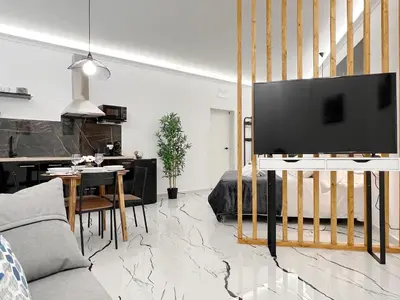 a living room with a large flat screen tv at Apartamento en la Gran Manzana in Valencia