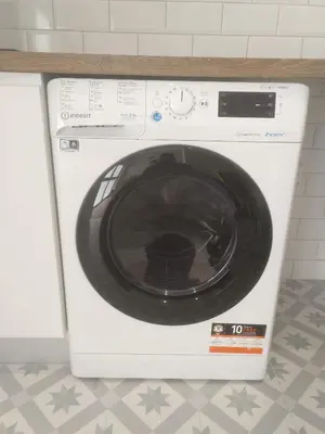 a white washing machine sitting in a kitchen at Apartamento moderno de 70 metros a 300 metros de la playa in Valencia