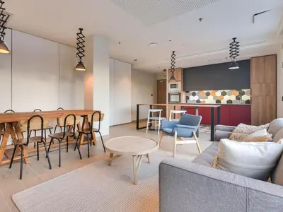 a living room with a couch and a table at Livensa Living Studios Valencia Viveros Hotel - Apartamento in Valencia