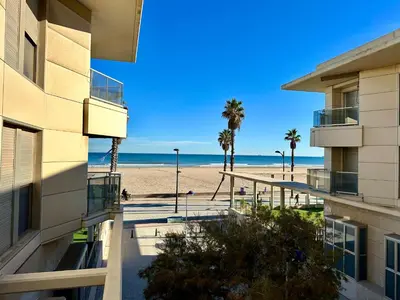 a view of the beach from the balcony of a building at Reinapart Patacona Beach 40 in Valencia