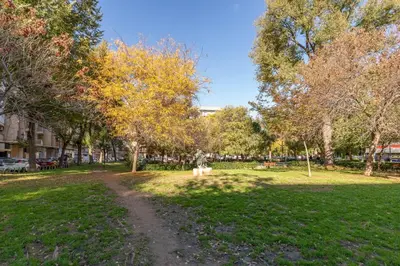 a park with trees and a dirt road at ApartUP Valencia Opera in Valencia