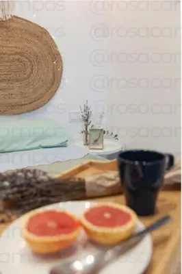 two slices of grapefruit on a plate on a table at AL5 Seaside Bliss-stylish loft steps from Malvarrosa in Valencia