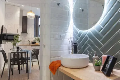 a kitchen with a large white tub on a counter at AL5 Seaside Bliss-stylish loft steps from Malvarrosa in Valencia