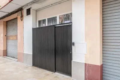 a pair of garage doors in a building at Increíble Loft junto a la ciudad de las ciencias in Valencia