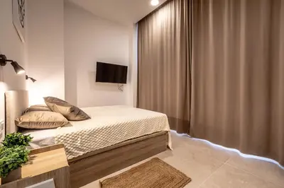 a bedroom with a bed and a television in it at Increíble Loft junto a la ciudad de las ciencias in Valencia