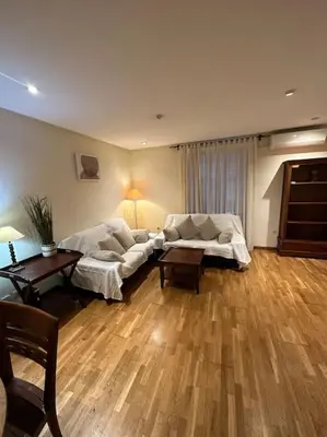 a living room with a couch and a table at Apartamento Almas Centro in Valencia