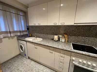 a kitchen with a sink and a washing machine at Apartamento Almas Centro in Valencia
