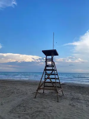 a lifeguard stand on the beach near the ocean at Ático Balinés con vistas al mar in Canet de Berenguer